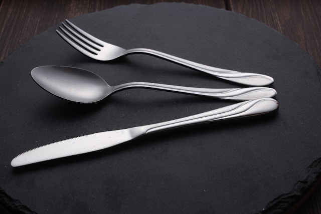 Elegant flatware arranged on a dining table